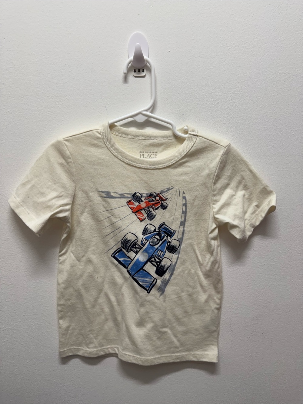 The Children's Place Cream Tee with Blue and Red Race Cars